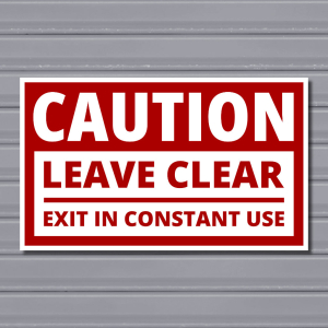 Leave Clear – Exit in Constant Use Sign (Line Divider, Red & White)